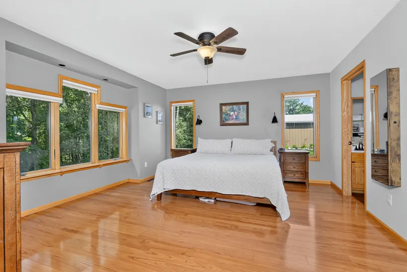 Primary bedroom with hardwood floors