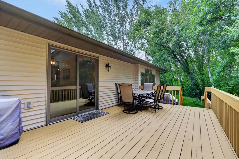 Large deck overlooking the wooded property