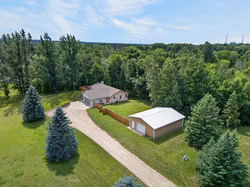 Aerial view of the home and detached shop