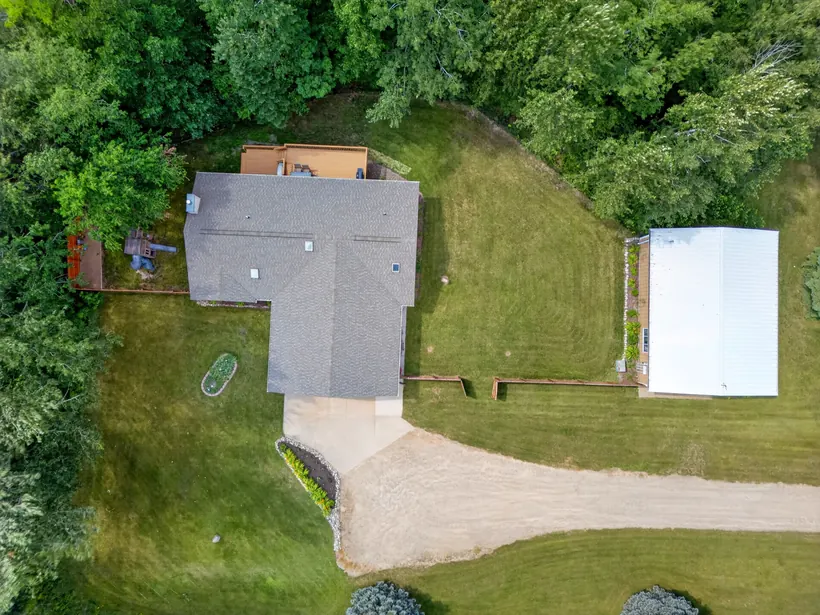 Overhead view of the home, yard, and detached shop
