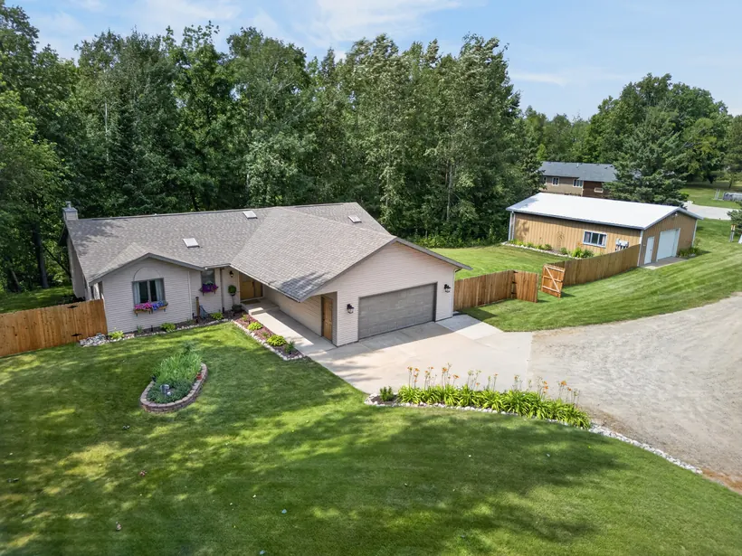 Aerial front view of the home and detached shop