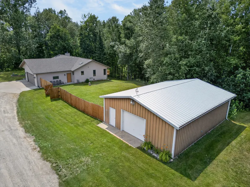 Aerial view featuring the detached metal shop
